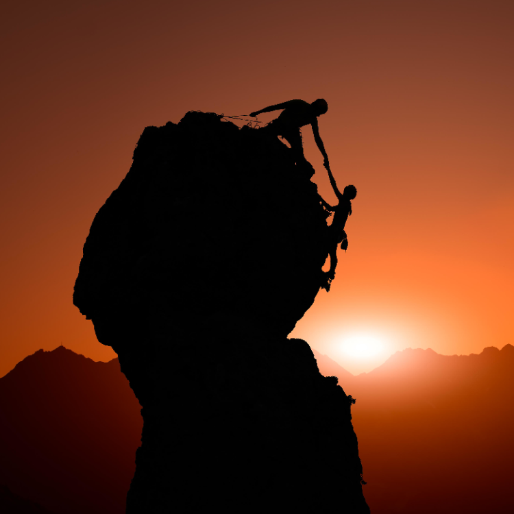 One climber holds another
